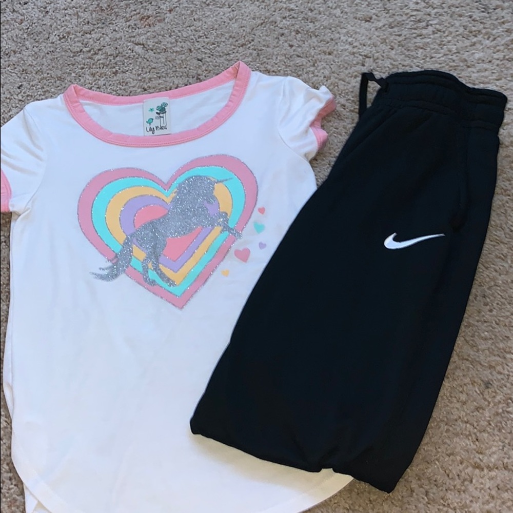 Unicorn shirt and Nike black joggers